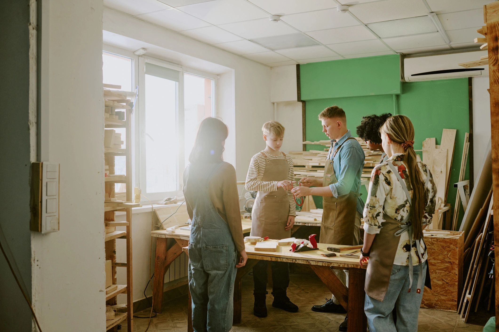 Creative community gathered around a workshop instructor